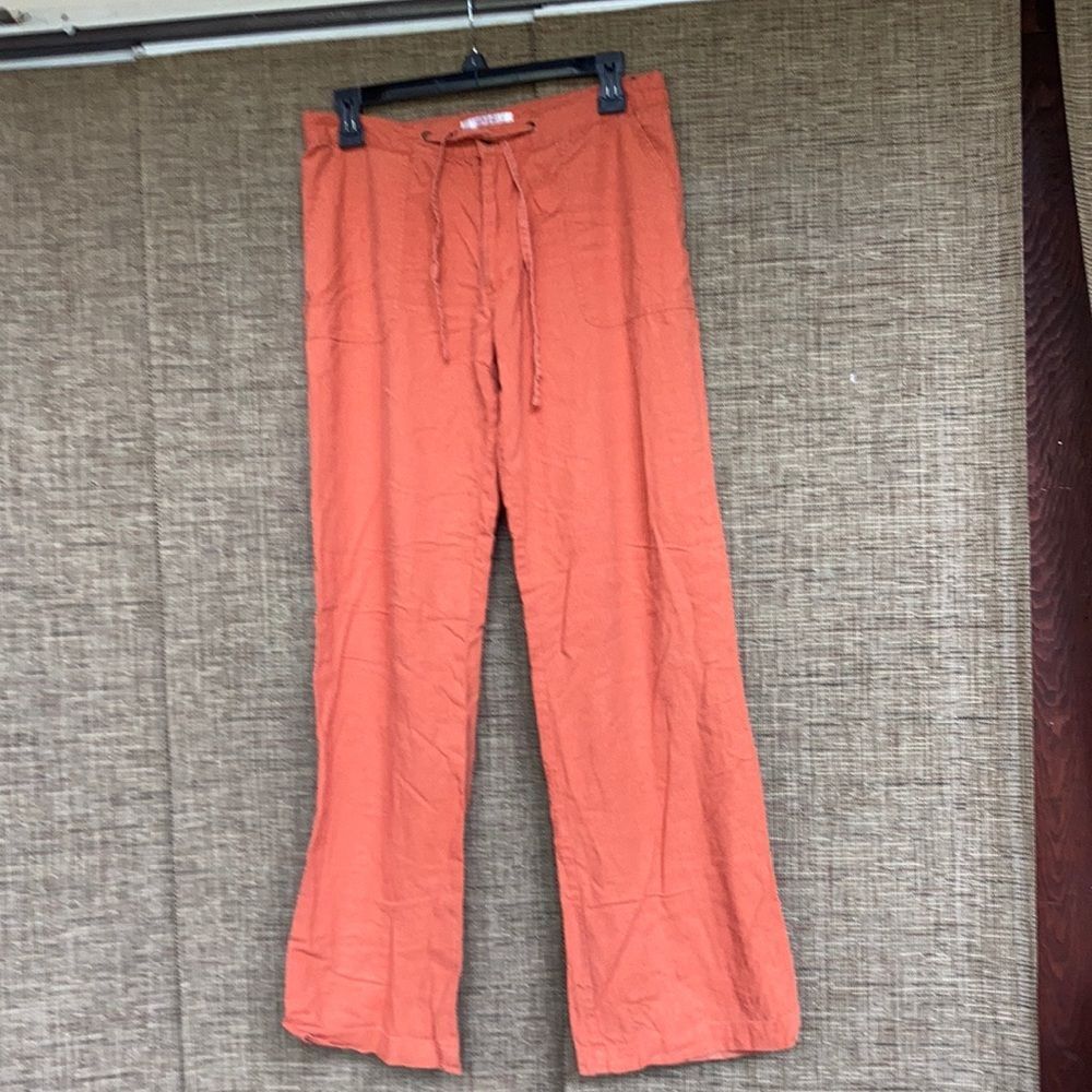 Travis Lucci linen wide leg pants color brick orange.